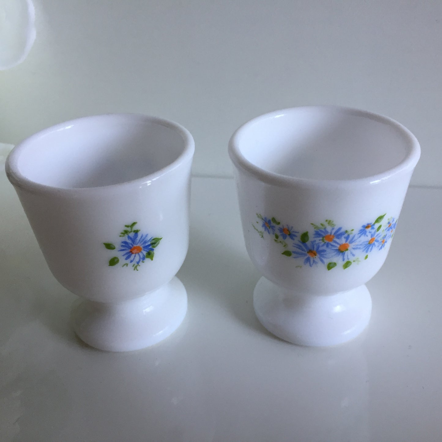 A Pair of Vintage Arcopal France Tempered Milk Glass Egg Cups | Blue Floral