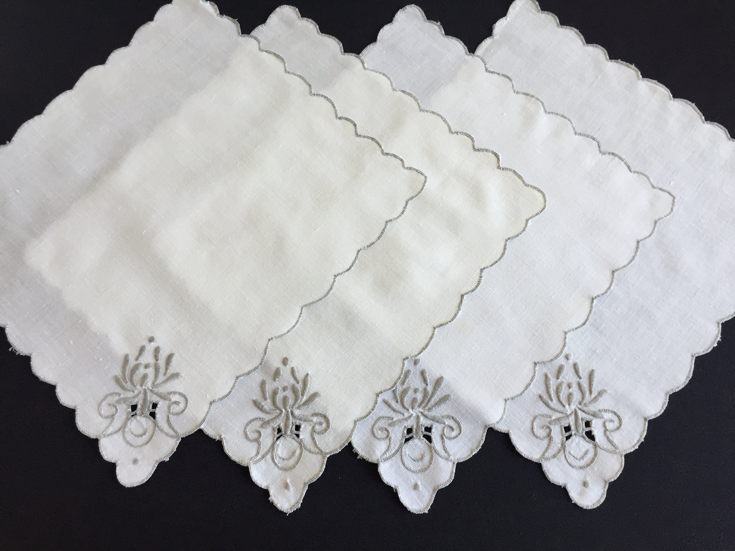 A Set of 4 Madeira Embroidered Cloth Napkins with Scalloped Edging