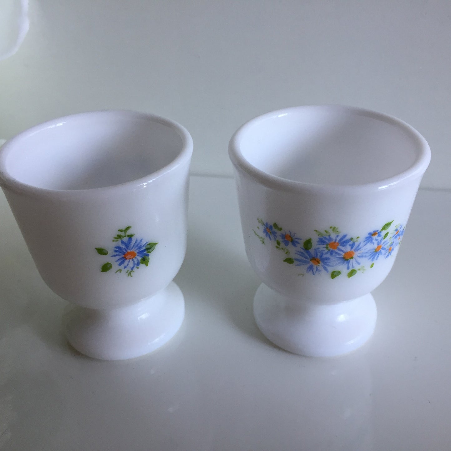 A Pair of Vintage Arcopal France Tempered Milk Glass Egg Cups | Blue Floral