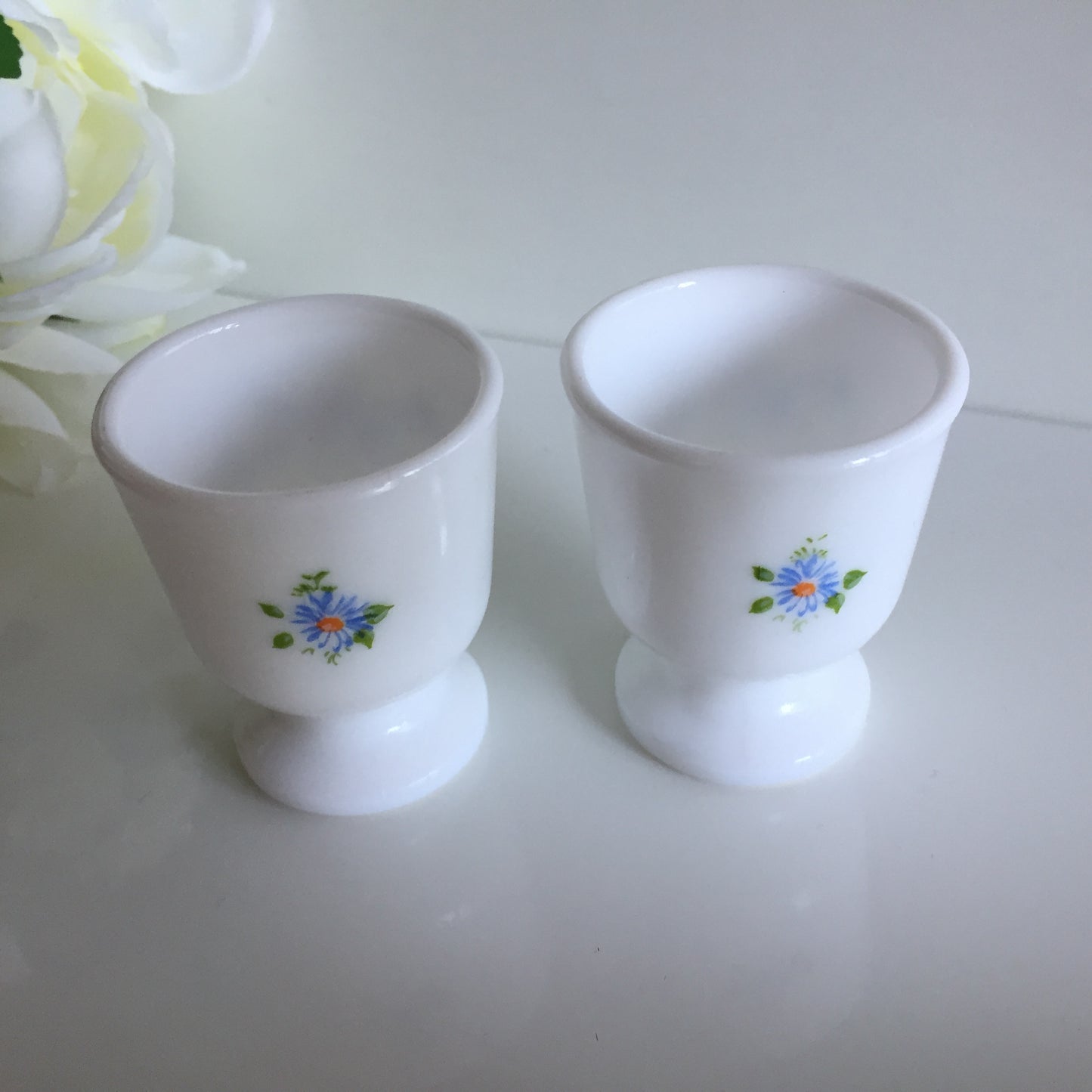 A Pair of Vintage Arcopal France Tempered Milk Glass Egg Cups | Blue Floral