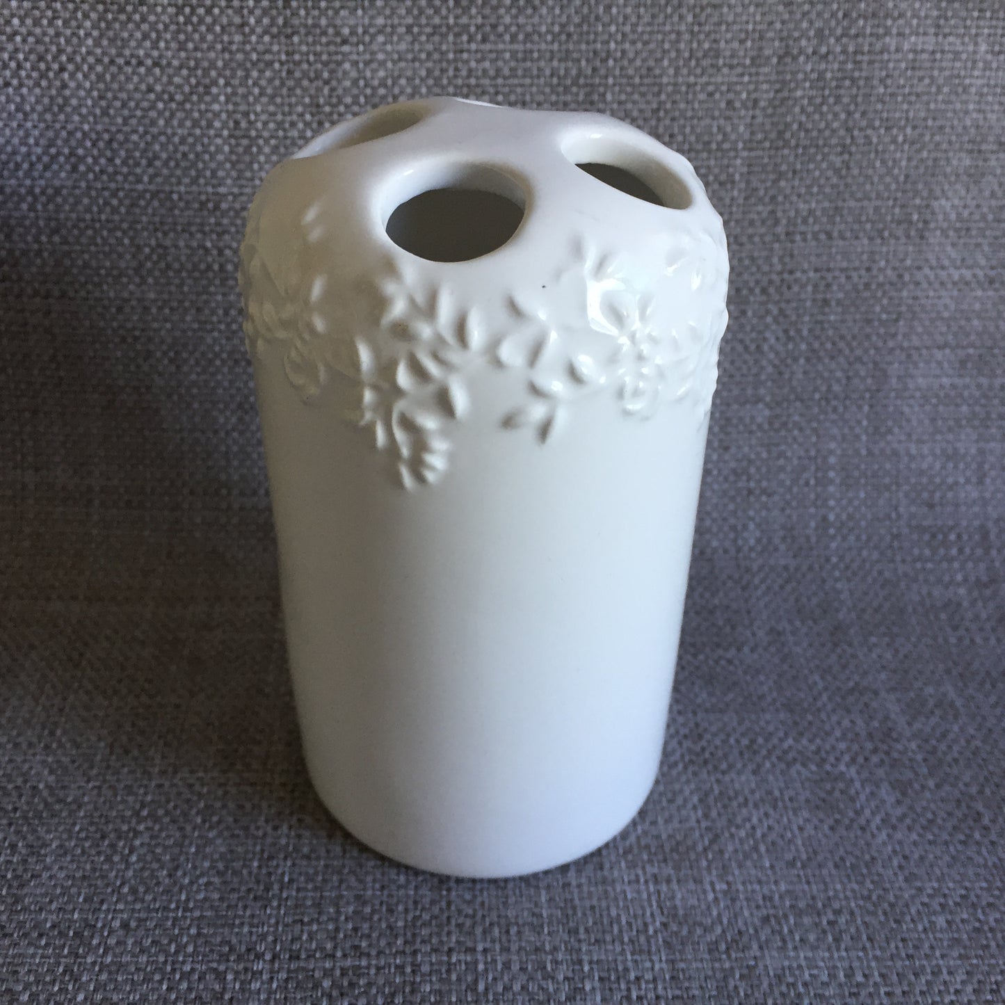 White Porcelain Toothbrush Holder with Embossed Floral Pattern