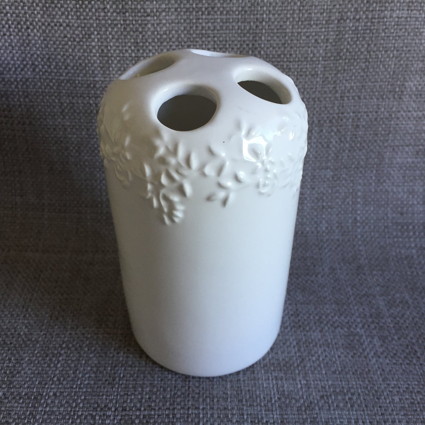 White Porcelain Toothbrush Holder with Embossed Floral Pattern