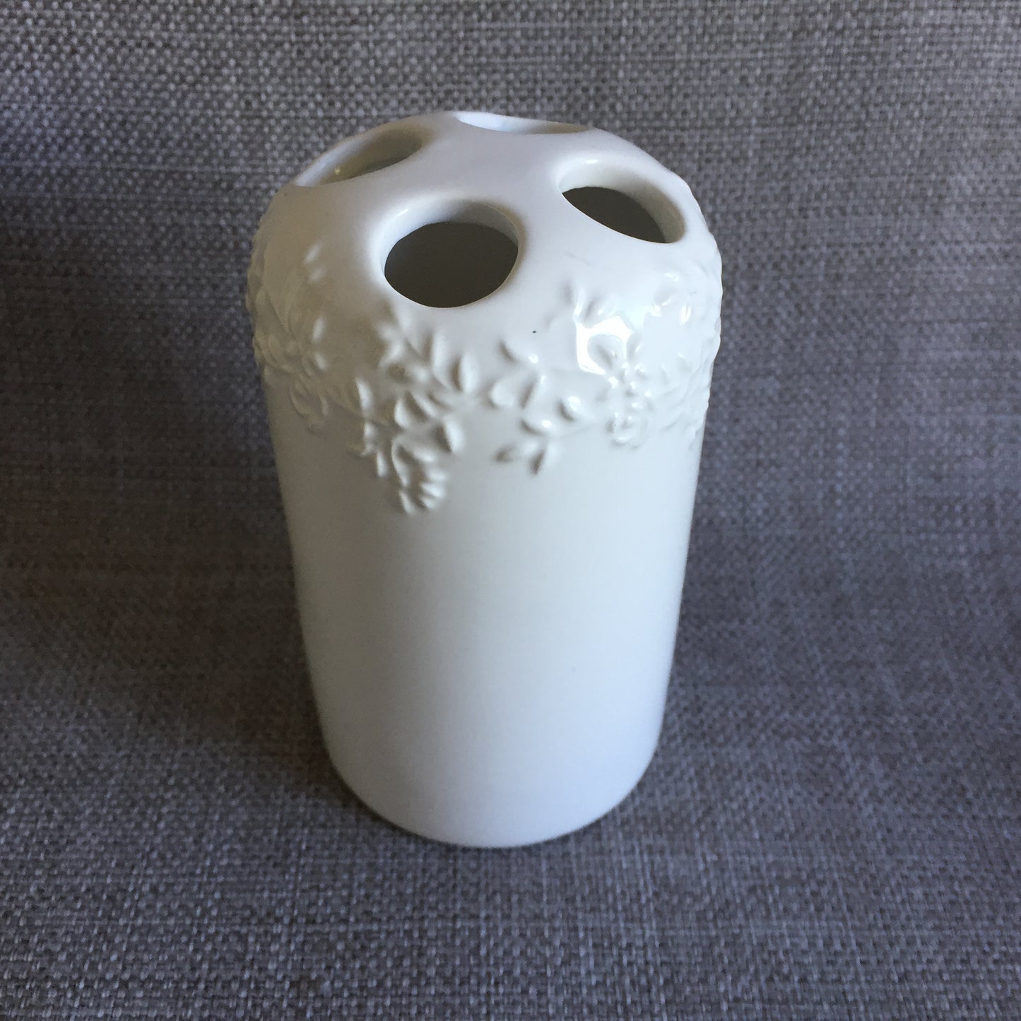 White Porcelain Toothbrush Holder with Embossed Floral Pattern