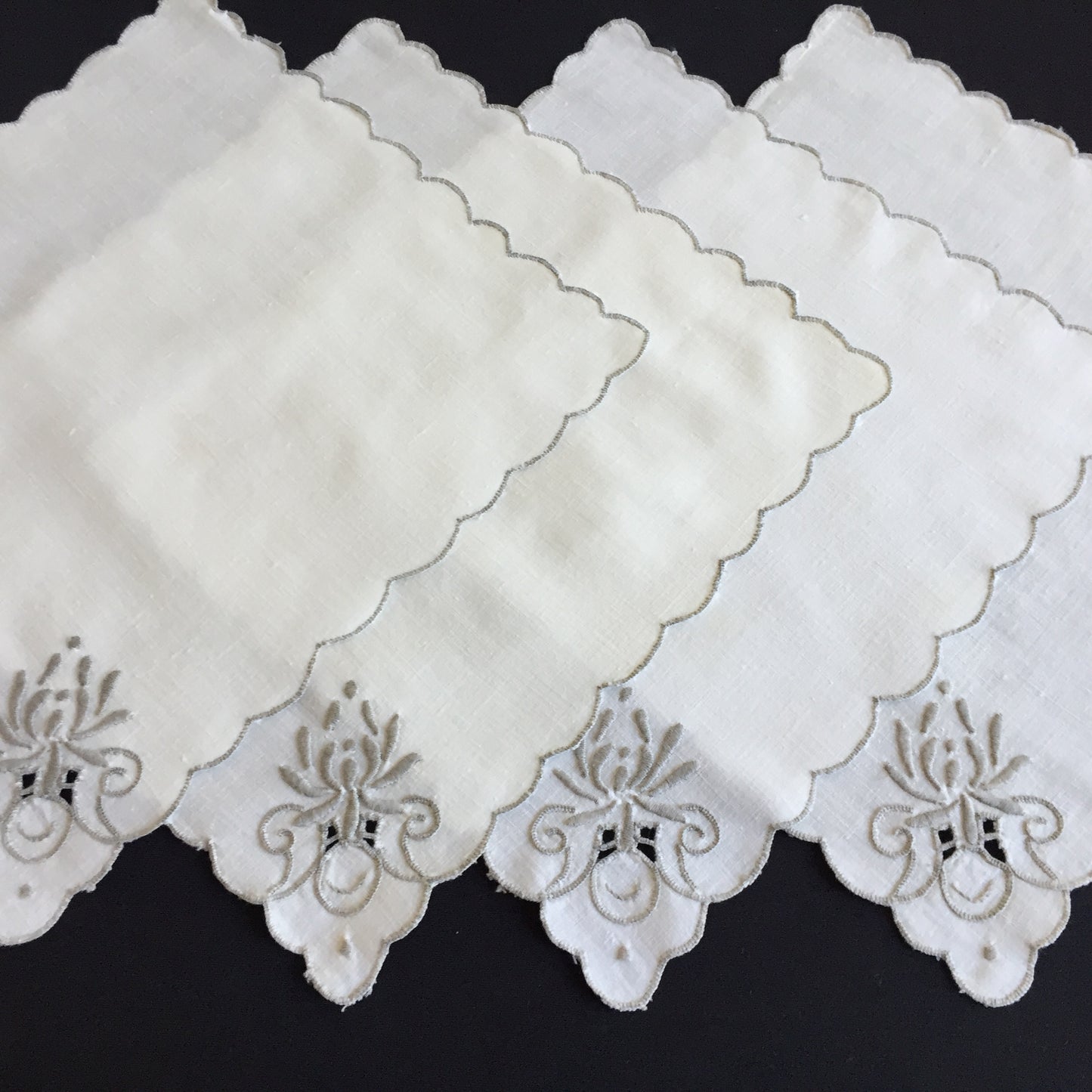 A Set of 4 Madeira Embroidered Cloth Napkins with Scalloped Edging