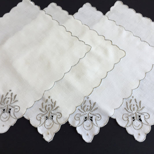 A Set of 4 Madeira Embroidered Cloth Napkins with Scalloped Edging