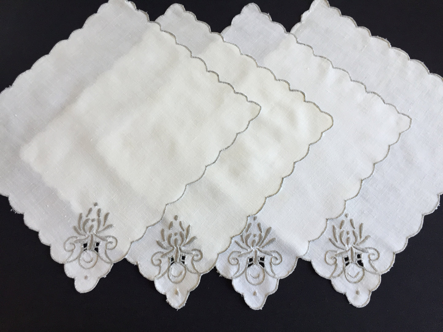 A Set of 4 Madeira Embroidered Cloth Napkins with Scalloped Edging