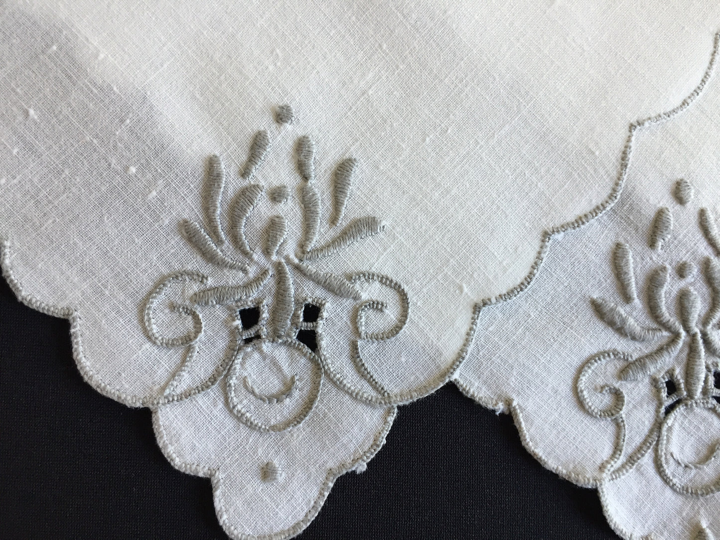 A Set of 4 Madeira Embroidered Cloth Napkins with Scalloped Edging