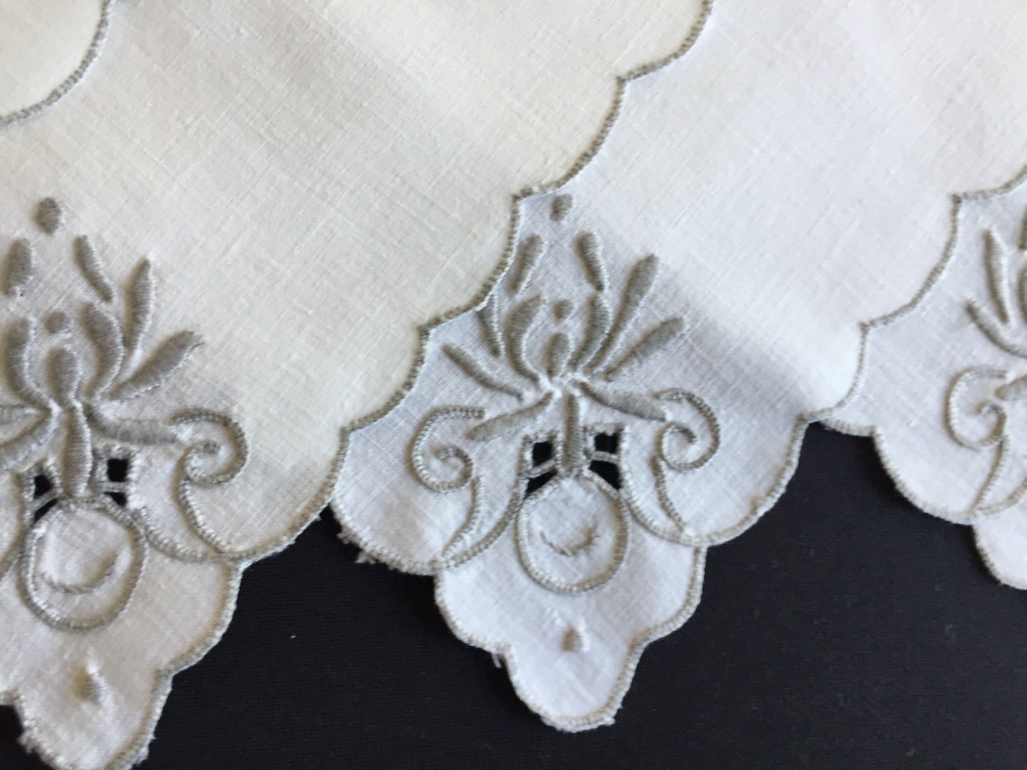 A Set of 4 Madeira Embroidered Cloth Napkins with Scalloped Edging