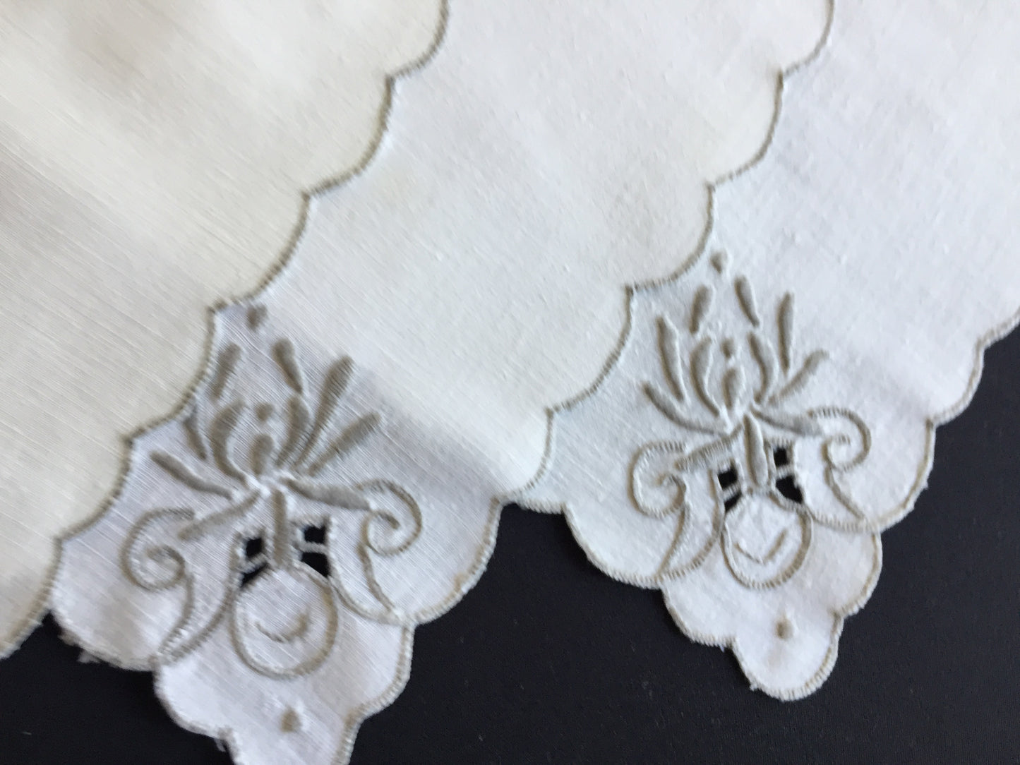A Set of 4 Madeira Embroidered Cloth Napkins with Scalloped Edging