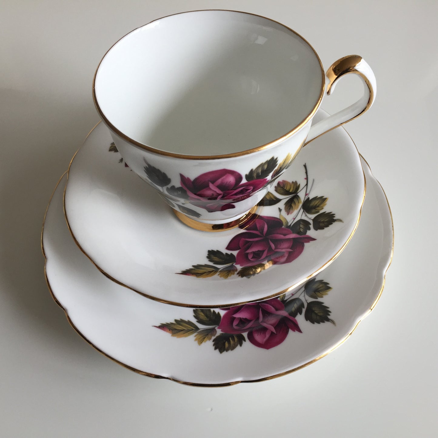 Vintage Porcelain Demitasse Trio with Rose Pattern: Teacup, Saucer & Dessert Plate