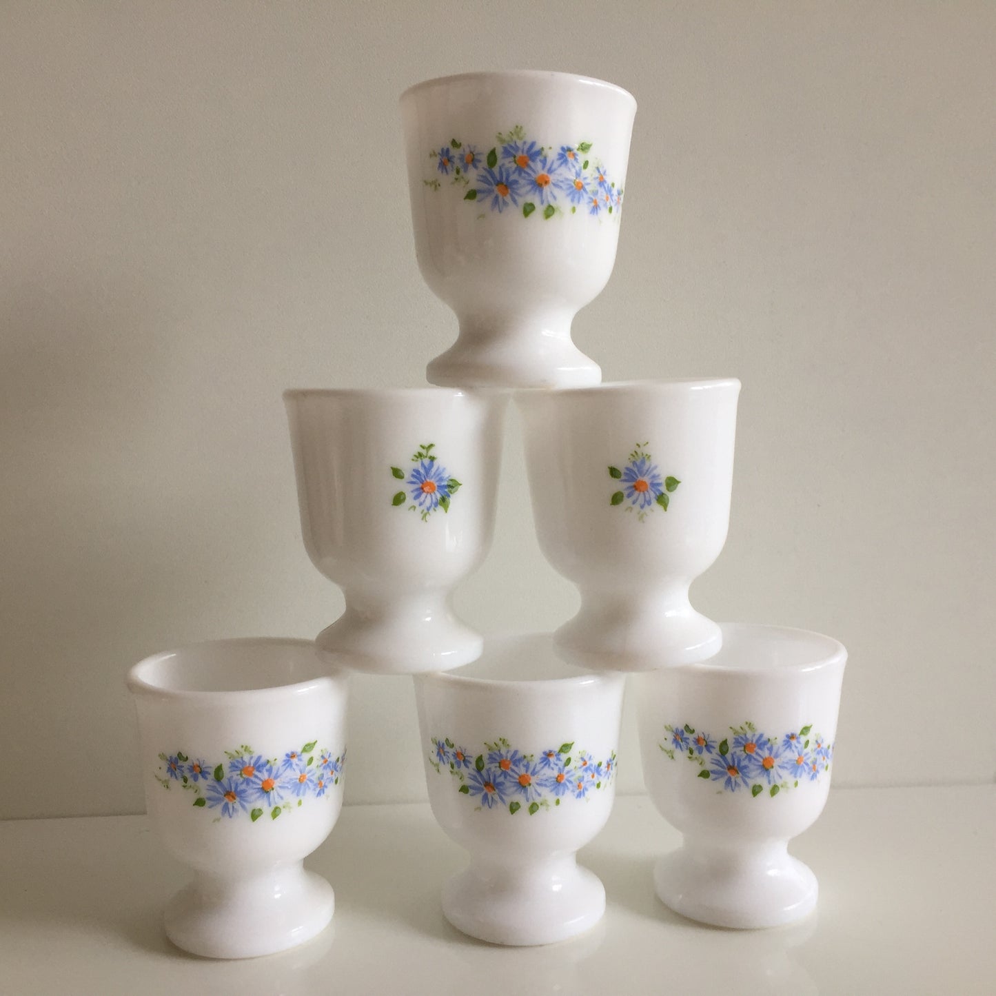 A Pair of Vintage Arcopal France Tempered Milk Glass Egg Cups | Blue Floral