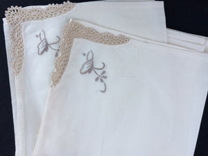 A Set of 4 Vintage Ivory and Ecru Embroidered Cotton Linen Napkins with Crochet Lace Corners