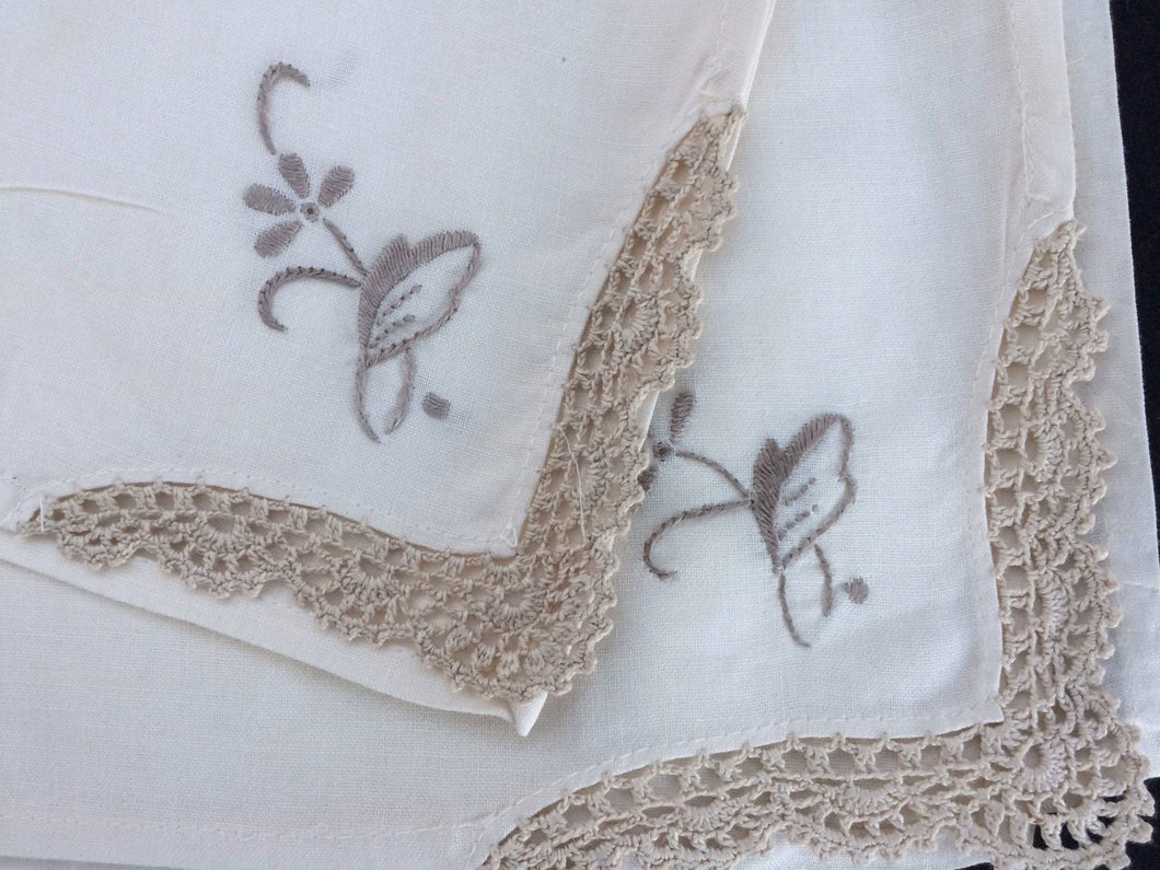 A Set of 4 Vintage Ivory and Ecru Embroidered Cotton Linen Napkins with Crochet Lace Corners