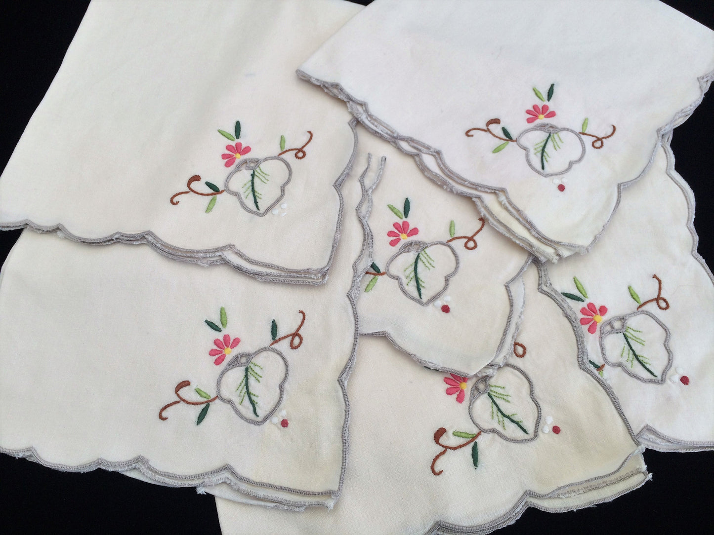 A Set of 6 Hand Embroidered Ivory Linen Vintage Madeira Cutwork Linen Napkins with Grey Scalloped Edging
