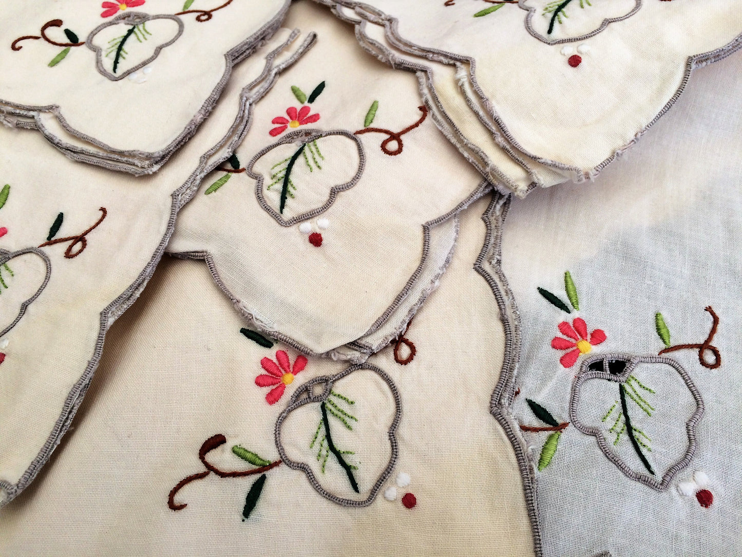 A Set of 6 Hand Embroidered Ivory Linen Vintage Madeira Cutwork Linen Napkins with Grey Scalloped Edging