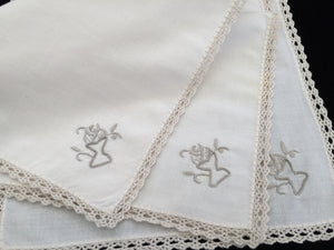 A Set of 3 Hand Embroidered Vintage Ivory Linen Napkins with Ecru Crochet Lace Edging