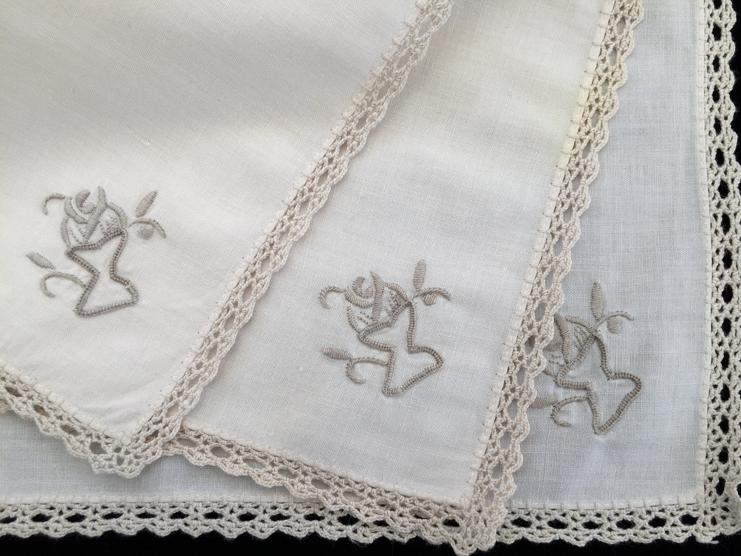 A Set of 3 Hand Embroidered Vintage Ivory Linen Napkins with Ecru Crochet Lace Edging